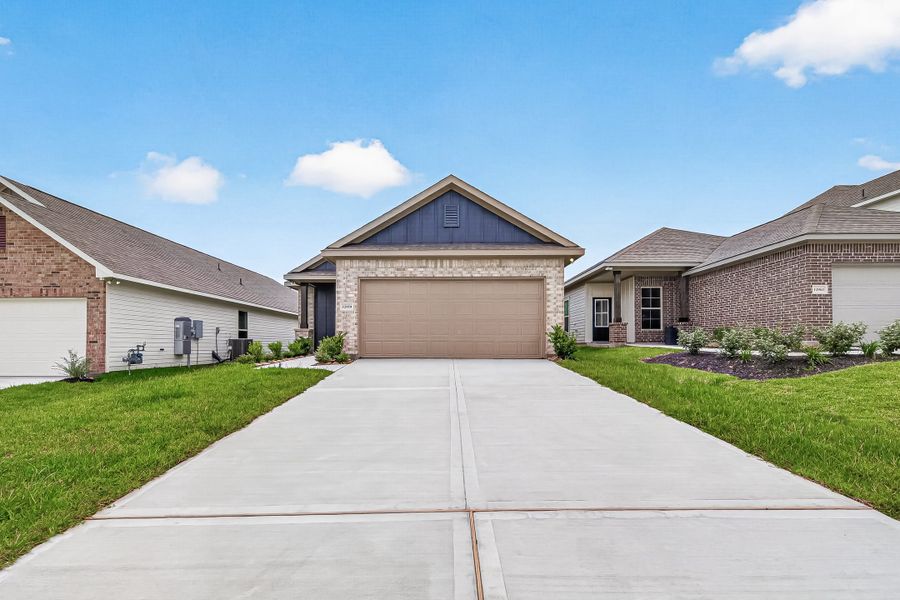 Front exterior of a new home in Mostyn Springs, Magnolia, TX, highlighting curb appeal (Image 27).