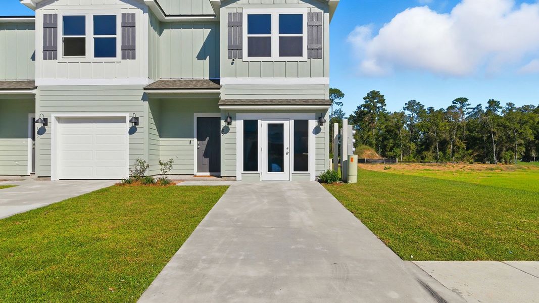 Front exterior of a new home in Revelry, Tallahassee, FL, highlighting curb appeal (Image 27). Front exterior of a new home in Revelry, Tallahassee, FL, highlighting curb appeal (Image 27).