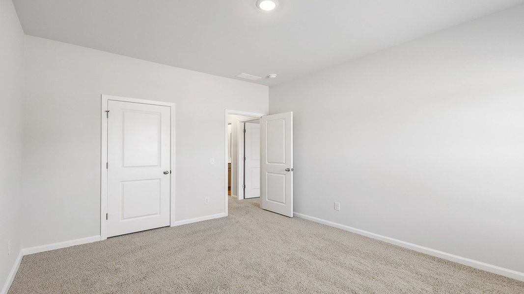 Spacious, unfurnished interior of a new home in The Crossing at St. James, Summerville (Image 20).