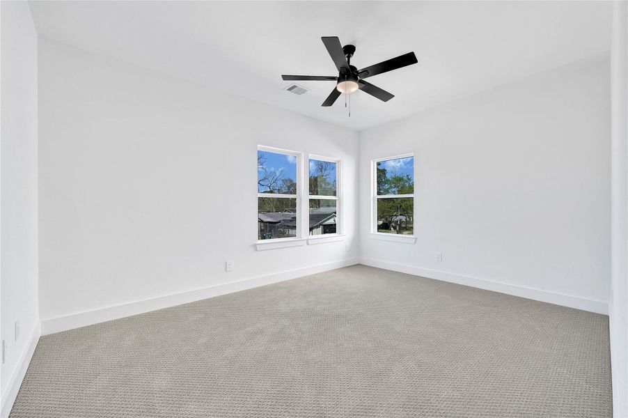 Comfortable secondary bedroom with great natural light.
