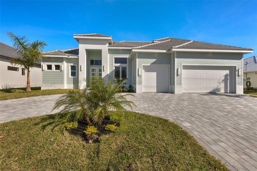 Front exterior of a new home in , Cape Coral, FL, highlighting curb appeal (Image 1).