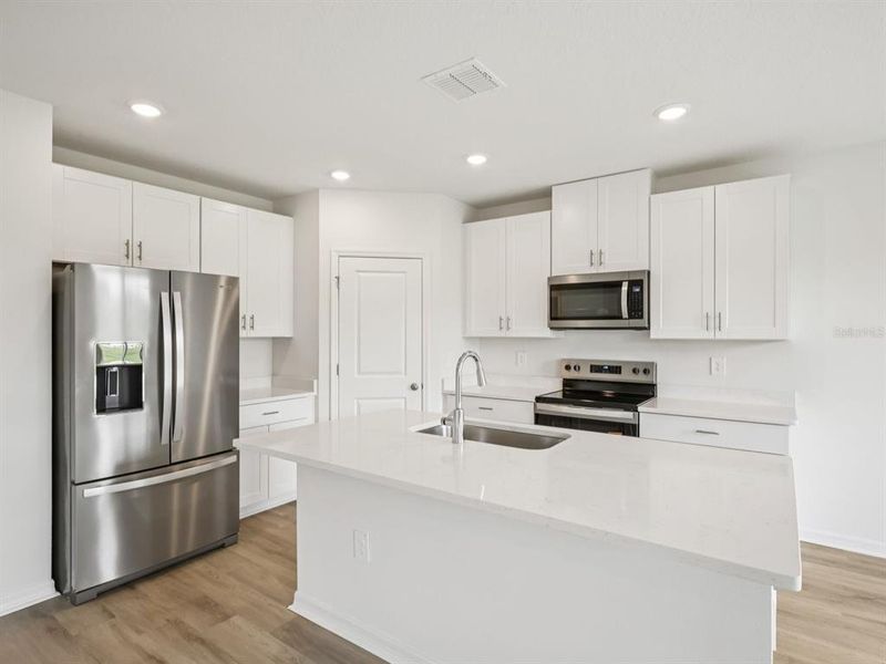 Furnished interior view inside a new home in The Reserve at Van Oaks, Auburndale (Image 4).