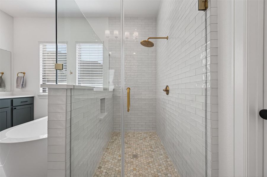 Large walk in shower with frameless glass doors and tile to the ceiling Large walk in shower with frameless glass doors and tile to the ceiling