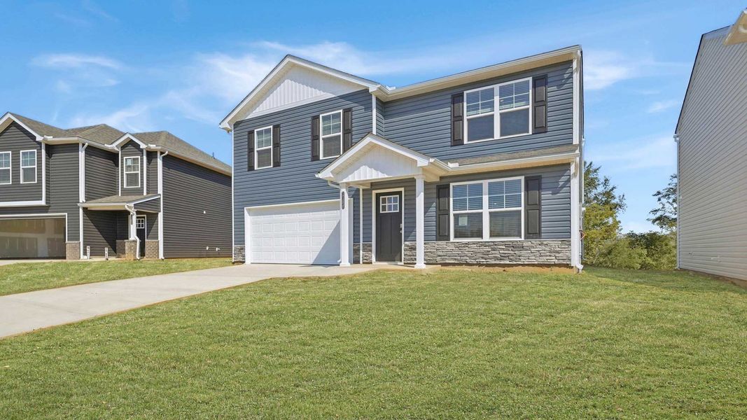 Front exterior of a new home in Johnson Farms, Greeneville, TN, highlighting curb appeal (Image 1). Front exterior of a new home in Johnson Farms, Greeneville, TN, highlighting curb appeal (Image 1).
