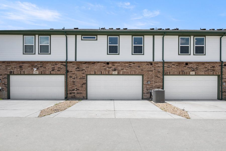Front exterior of a new home in Mockingbird Estates Townhomes, Fort Worth, TX, highlighting curb appeal (Image 15).