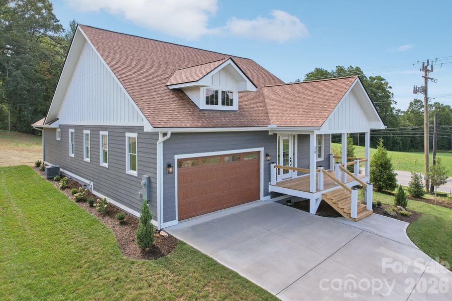 Front exterior of a new home in , Hendersonville, NC, highlighting curb appeal (Image 21).