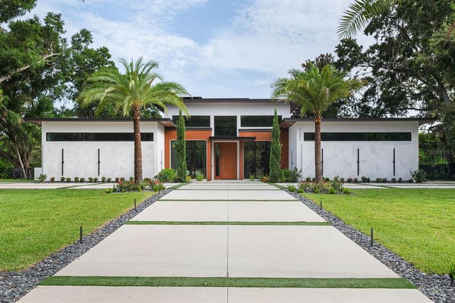 Front exterior of a new home in , Windermere, FL, highlighting curb appeal (Image 1). Front exterior of a new home in , Windermere, FL, highlighting curb appeal (Image 1).
