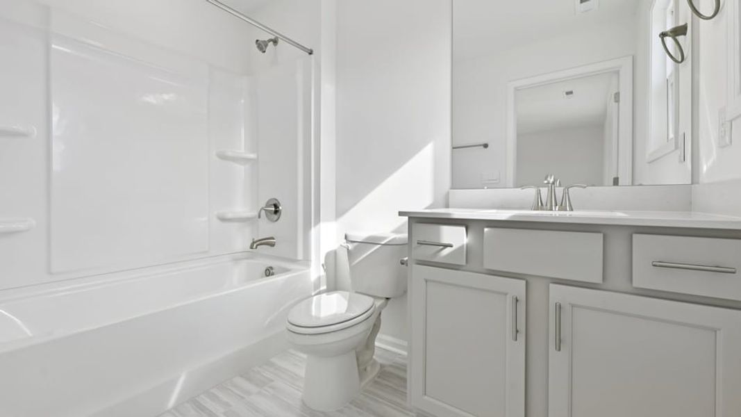 Representative furnished interior of a home built from the Wylie by D.R. Horton in Eagle Creek, Fuquay Varina (Image 11).