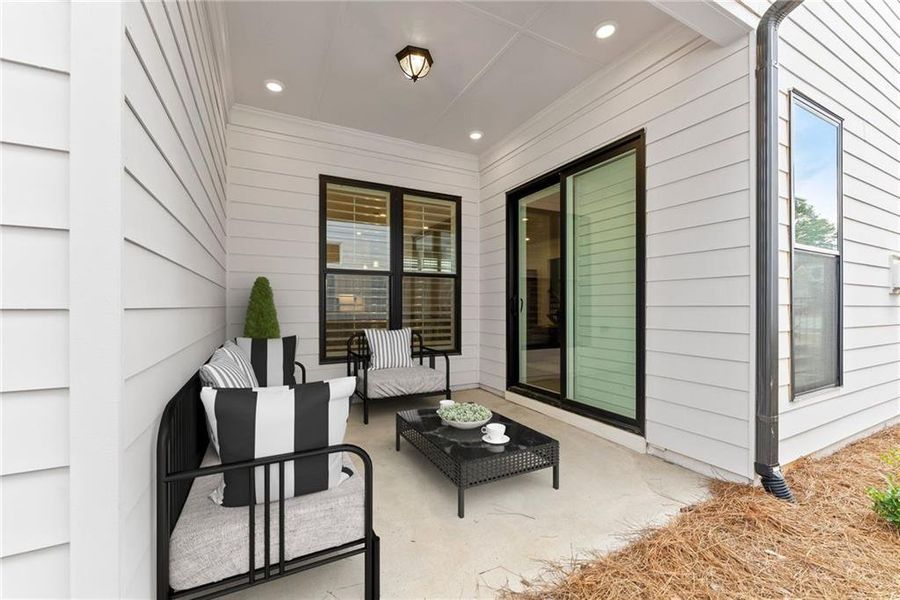 Exterior details and patio area of a home in Promenade at Sawnee Village, Cumming (Image 32).