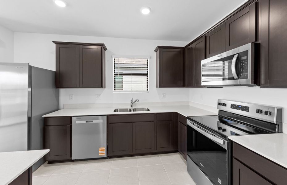 Furnished interior view inside a new home in Caloosa Cove, Labelle (Image 9).