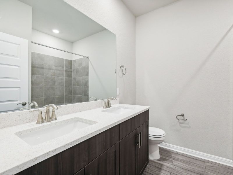 This full secondary bathroom helps make getting ready easier for everyone.