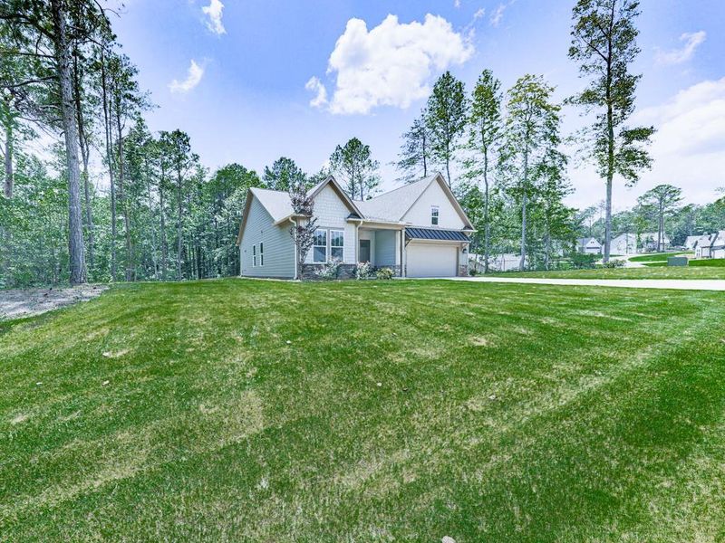 Front exterior of a new home in , Ellijay, GA, highlighting curb appeal (Image 24).