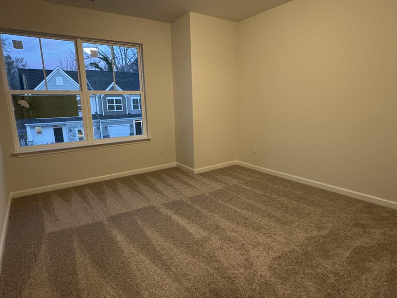 Spacious, unfurnished interior of a new home in East Main Townes, Spartanburg (Image 14).