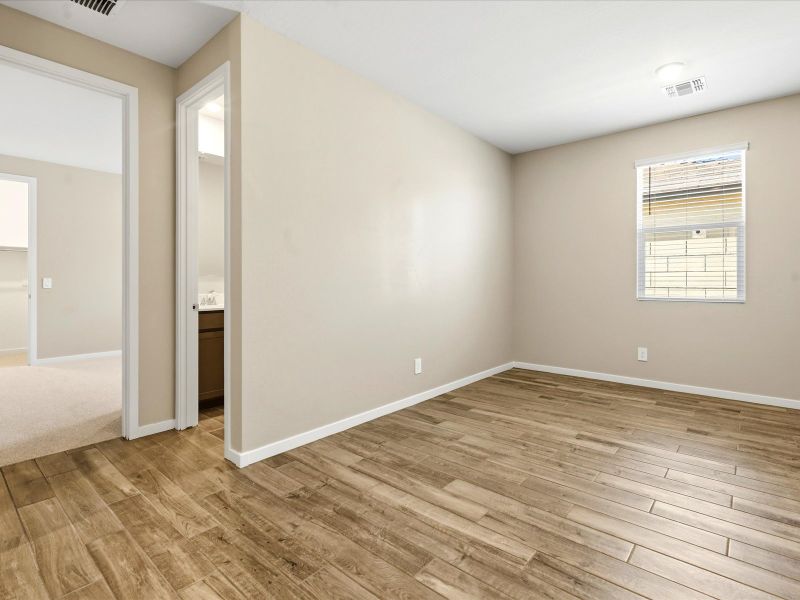 Spacious, unfurnished interior of a new home in White Tank Foothills Signature Series, Waddell (Image 14).