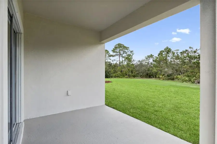 Exterior details and patio area of a home in Crossroads at Kelly Park, Apopka (Image 3).
