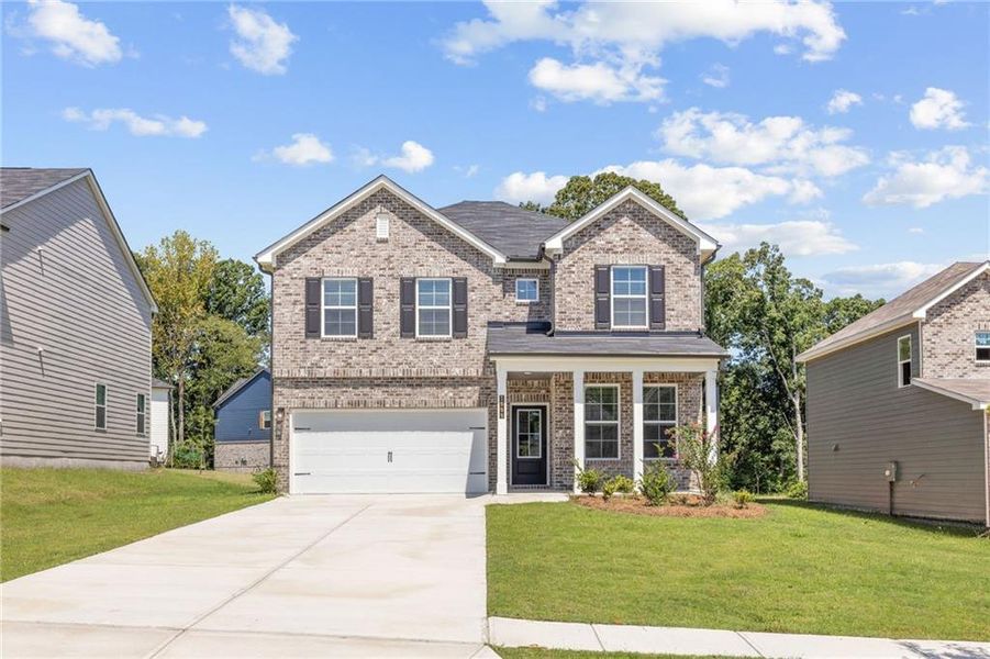 Front exterior of a new home in Oak Grove Glen, Snellville, GA, highlighting curb appeal (Image 1). Front exterior of a new home in Oak Grove Glen, Snellville, GA, highlighting curb appeal (Image 1).