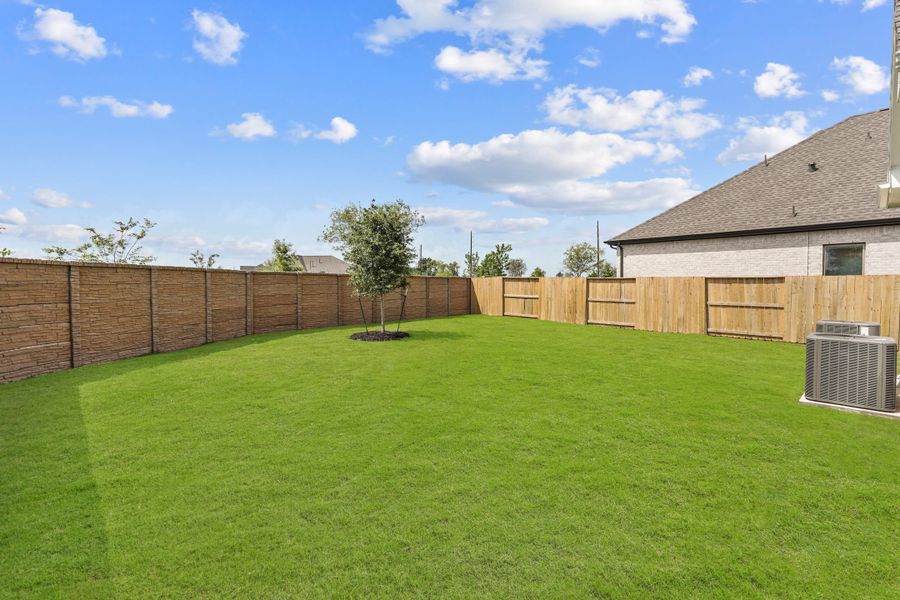 Exterior details and patio area of a home in Bridgeland, Cypress (Image 34).