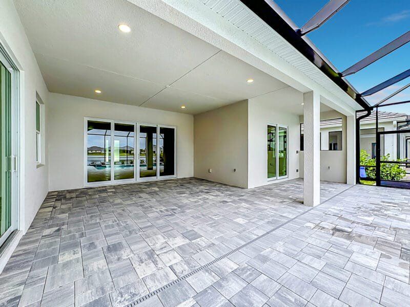Exterior details and patio area of a home in River Preserve Estates, Parrish (Image 26).
