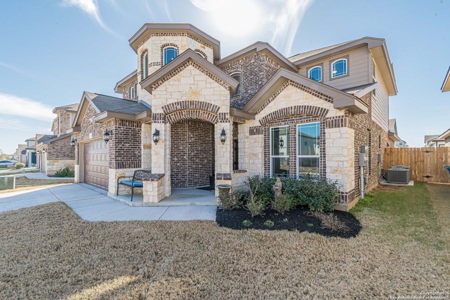 Front exterior of a new home in Hiddenbrooke, Seguin, TX, highlighting curb appeal (Image 19).