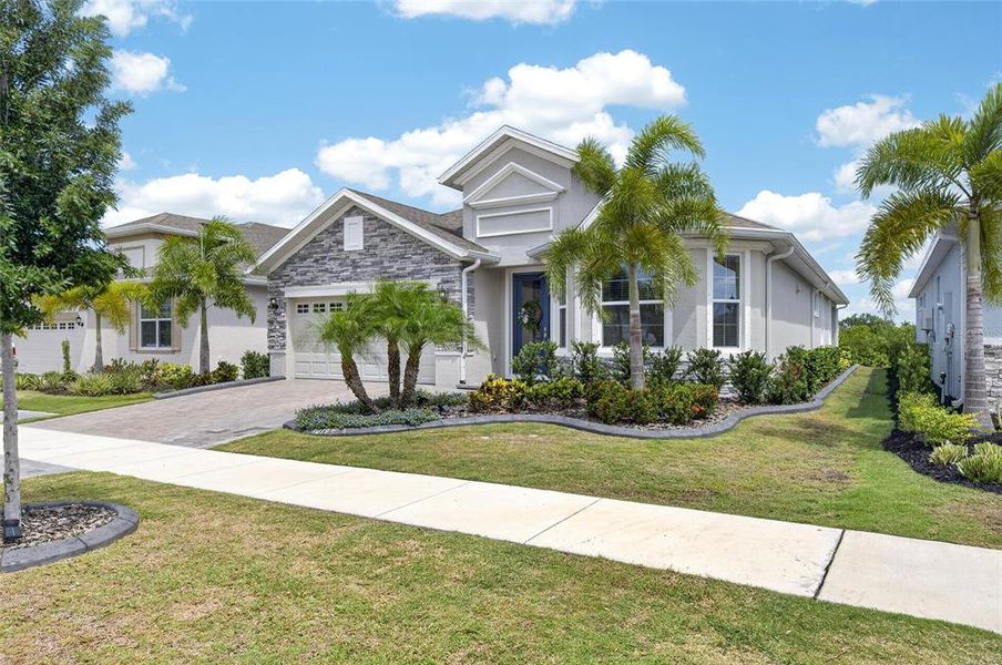 Front exterior of a new home in , Apollo Beach, FL, highlighting curb appeal (Image 27).