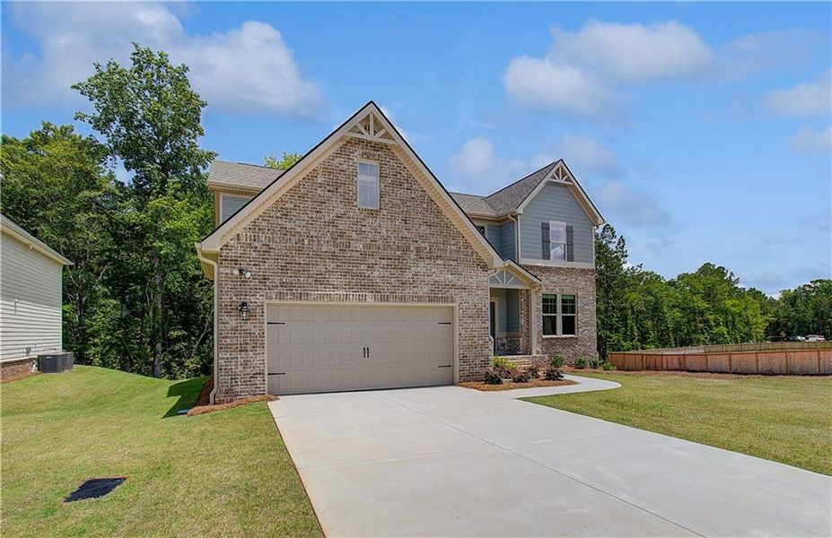 Front exterior of a new home in Kingston, Locust Grove, GA, highlighting curb appeal (Image 20).