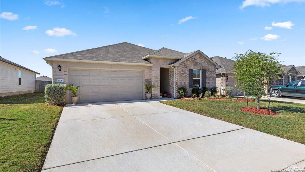 Front exterior of a new home in Arroyo Ranch, Seguin, TX, highlighting curb appeal (Image 1).