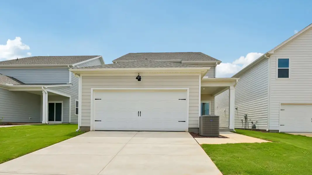 Front exterior of a new home in Collins Ridge, Hillsborough, NC, highlighting curb appeal (Image 23).