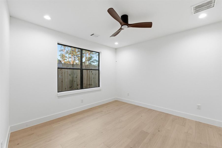 Bright and inviting, the secondary bedrooms offer stylish finishes and flexible space perfect for family or guests.