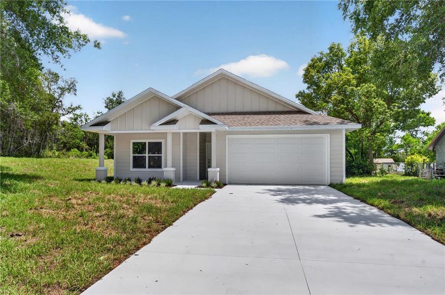 Front exterior of a new home in , Deltona, FL, highlighting curb appeal (Image 22). Front exterior of a new home in , Deltona, FL, highlighting curb appeal (Image 22).