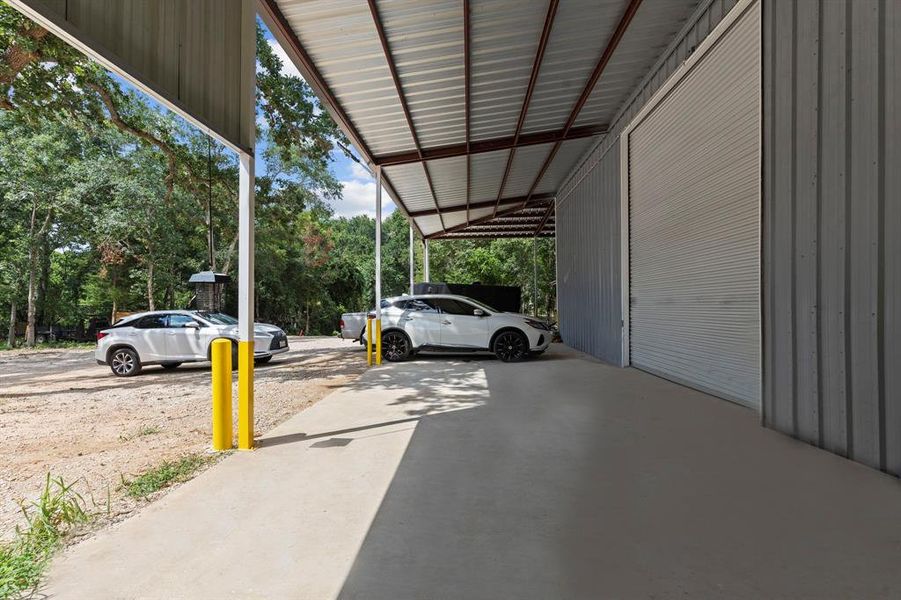 This Amazing Workshop has Huge wrap Around Covered Patio for Cars to Park below and more!