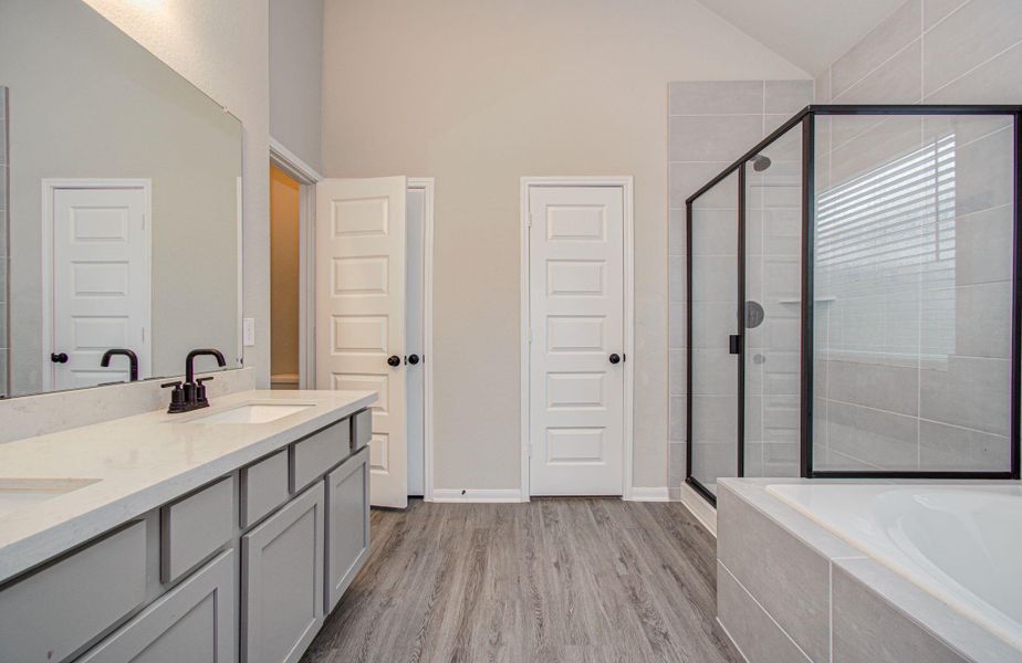 Spacious primary bath also includes separated privacy water closet