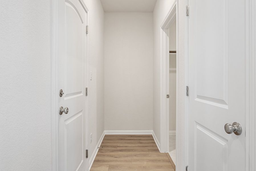 Representative unfurnished interior of a home built from the Somerville by Ashton Woods in Willow Springs, Buda (Image 19).