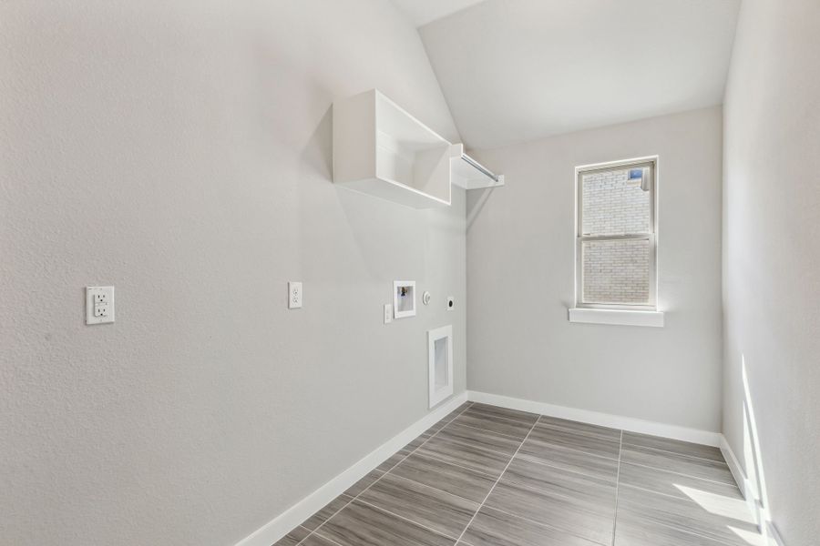 Utility Room in the Bowie home plan by Trophy Signature Homes – REPRESENTATIVE PHOTO