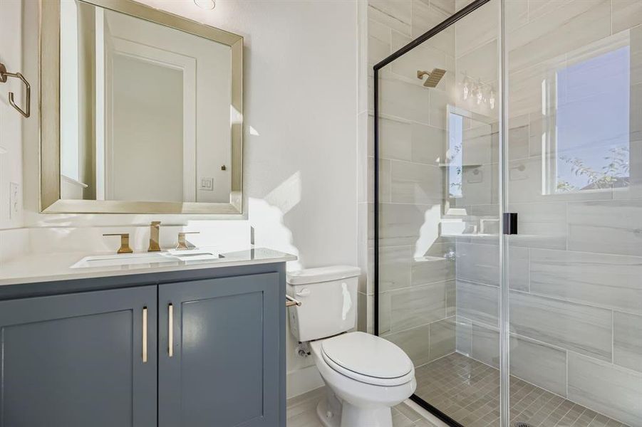 Bathroom with a stall shower and vanity Bathroom with a stall shower and vanity