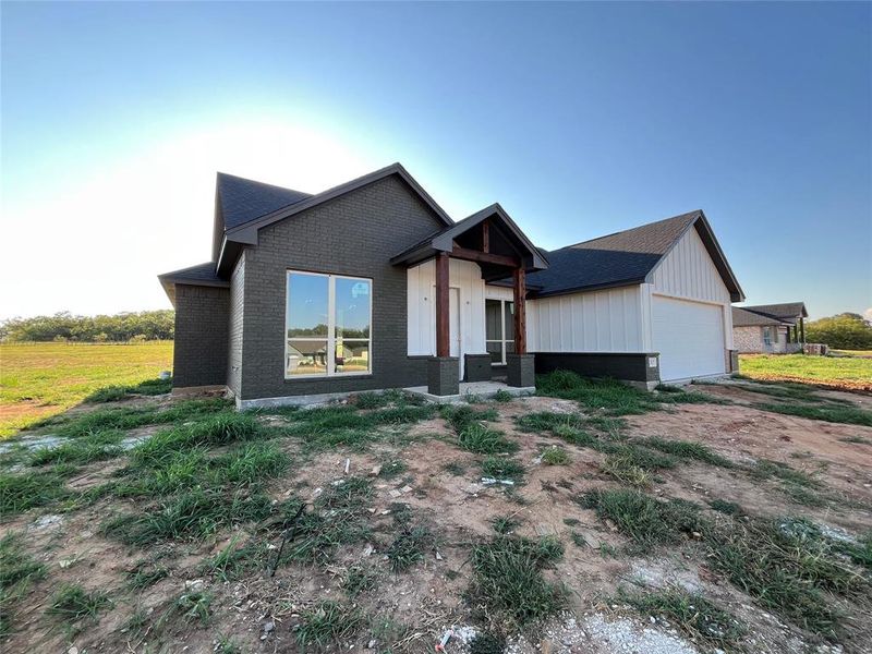 Front exterior of a new home in , Millsap, TX, highlighting curb appeal (Image 10). Front exterior of a new home in , Millsap, TX, highlighting curb appeal (Image 10).