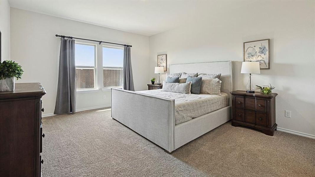 This room features two windows, light-colored walls, and carpeted flooring