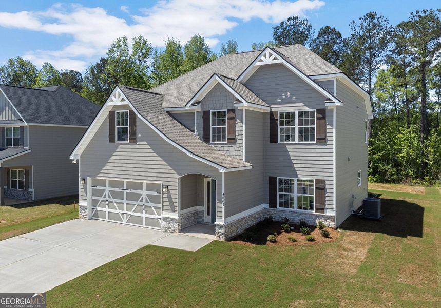 Front exterior of a new home in Juliette Crossing, Forsyth, GA, highlighting curb appeal (Image 27).