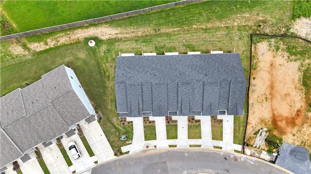 Front exterior of a new home in Village Green, Adairsville, GA, highlighting curb appeal (Image 21).
