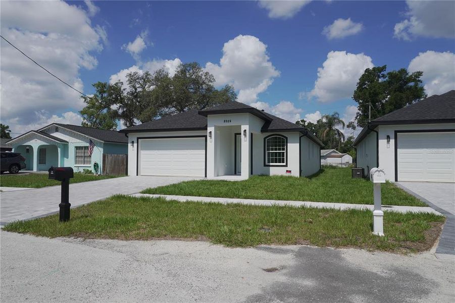 Front exterior of a new home in , Tampa, FL, highlighting curb appeal (Image 28). Front exterior of a new home in , Tampa, FL, highlighting curb appeal (Image 28).