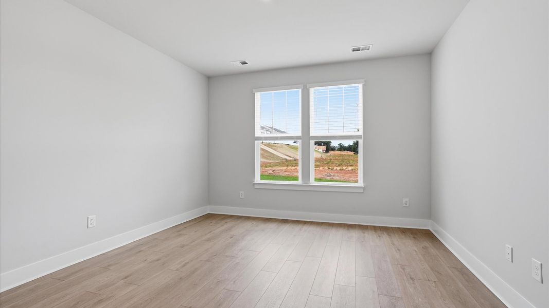 Vibrant natural light fills this exceptional primary suite with eye-catching details near Downtown Anderson Vibrant natural light fills this exceptional primary suite with eye-catching details near Downtown Anderson