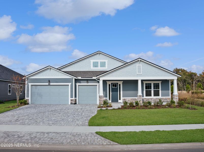 Front exterior of a new home in RiverTown - Springs, St. Johns, FL, highlighting curb appeal (Image 15).