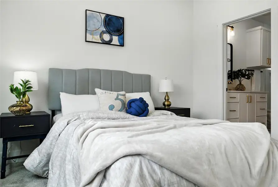 A peak into your lovely en-suite bath from the cozy primary bedroom. Spacious enough for a king sized furniture set! A peak into your lovely en-suite bath from the cozy primary bedroom. Spacious enough for a king sized furniture set!