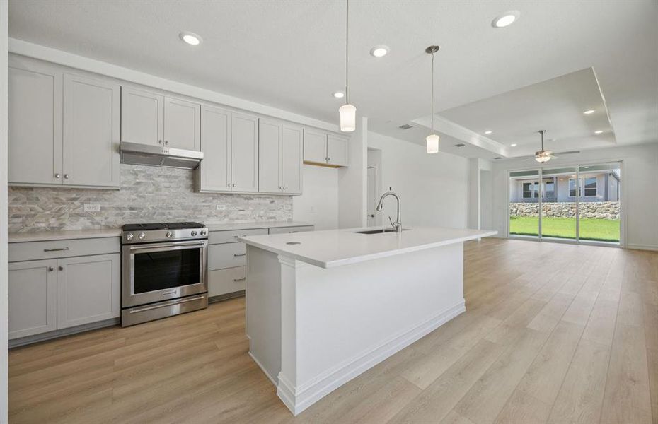 Kitchen featuring a large island ideal for informal dining and gatherings *Real home pictured Kitchen featuring a large island ideal for informal dining and gatherings *Real home pictured