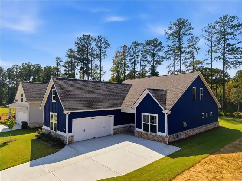 Front exterior of a new home in Heritage Pointe at The Georgian, Villa Rica, GA, highlighting curb appeal (Image 17). Front exterior of a new home in Heritage Pointe at The Georgian, Villa Rica, GA, highlighting curb appeal (Image 17).