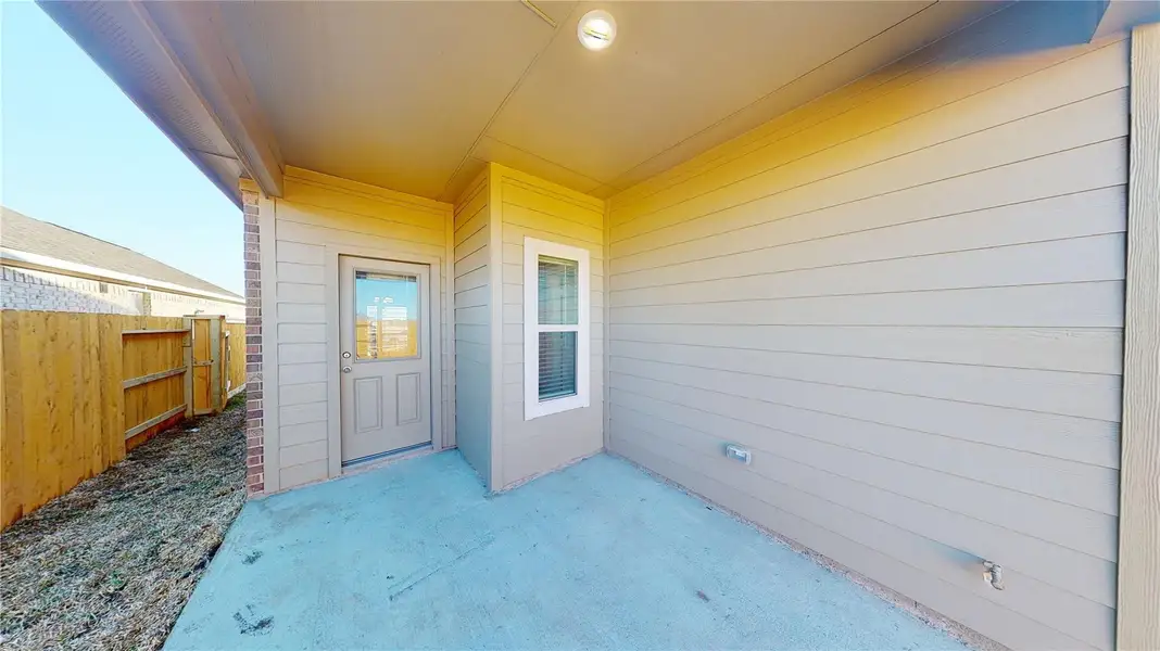 Exterior details and patio area of a home in Splendora Fields, Splendora (Image 4).