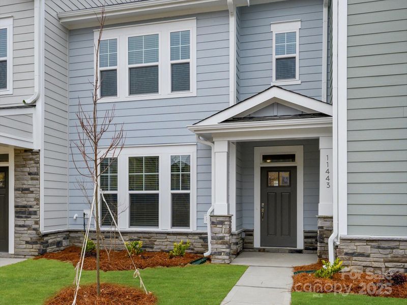 Exterior details and patio area of a home in North Creek Village, Huntersville (Image 4).