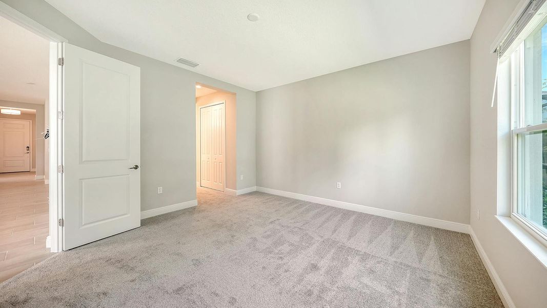 Spacious, unfurnished interior of a new home in Wildleaf Real Estate and Homes for Sale in Parrish, FL - Neal Communities, Parrish (Image 30).