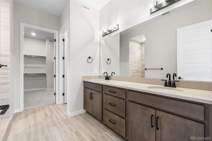 Furnished interior view inside a new home in Hilltop at Inspiration, Aurora (Image 16).