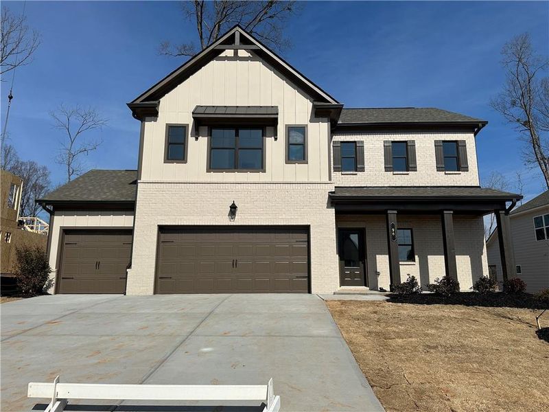Front exterior of a new home in Rosewood Lake Preserve, Hoschton, GA, highlighting curb appeal (Image 19).