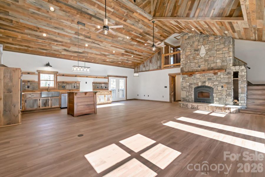 Great Room with Cathedral Ceilings and Soaring Stone Fireplace